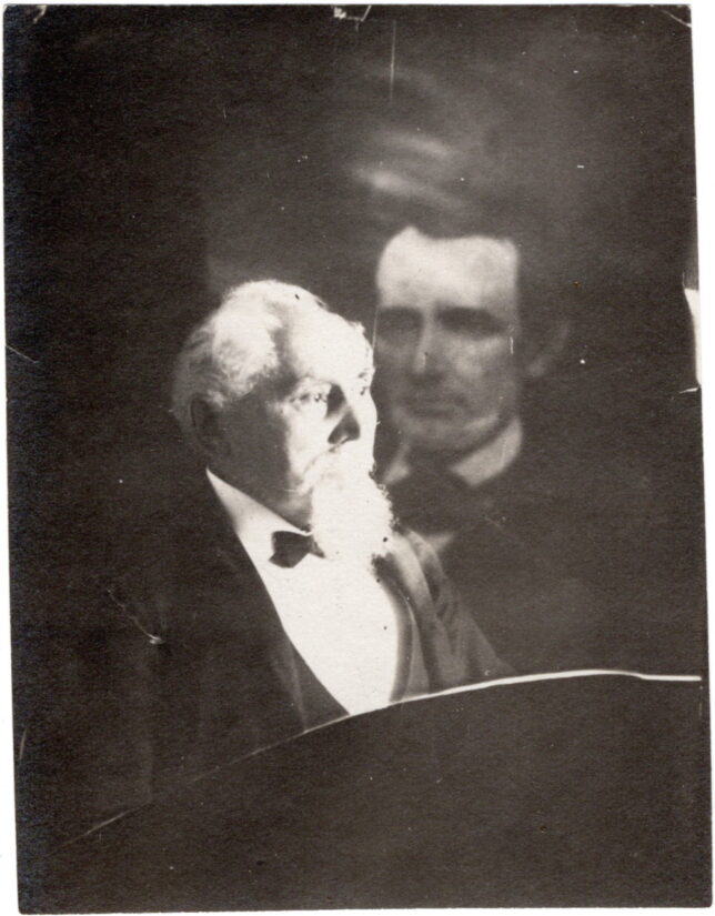 A 1903 spirit photograph by William M. Keeler featuring Dr. Theodor Hansmann and the spirit of Abraham Lincoln.